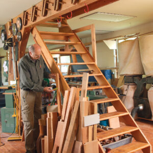 bins along attic stairs to save shop space